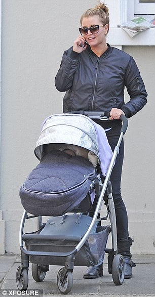 Holly valance taking new-born daughter Luka Violet for a shopping tour in a pram